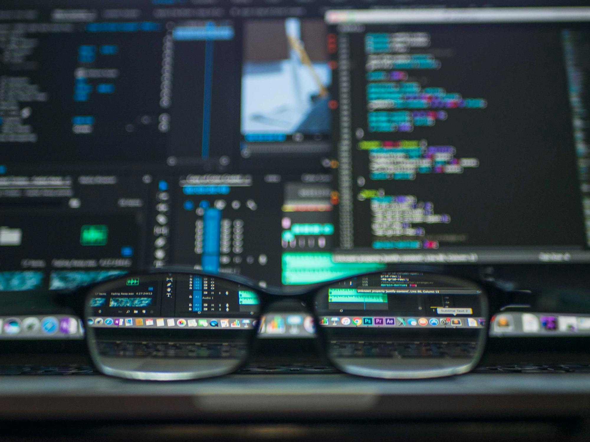 (Credit: Kevin Ku via Pexels) Glasses in front of computer screens displaying code